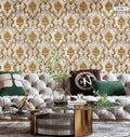 Decorative wallpaper with gold and beige patterns in a living room setting.